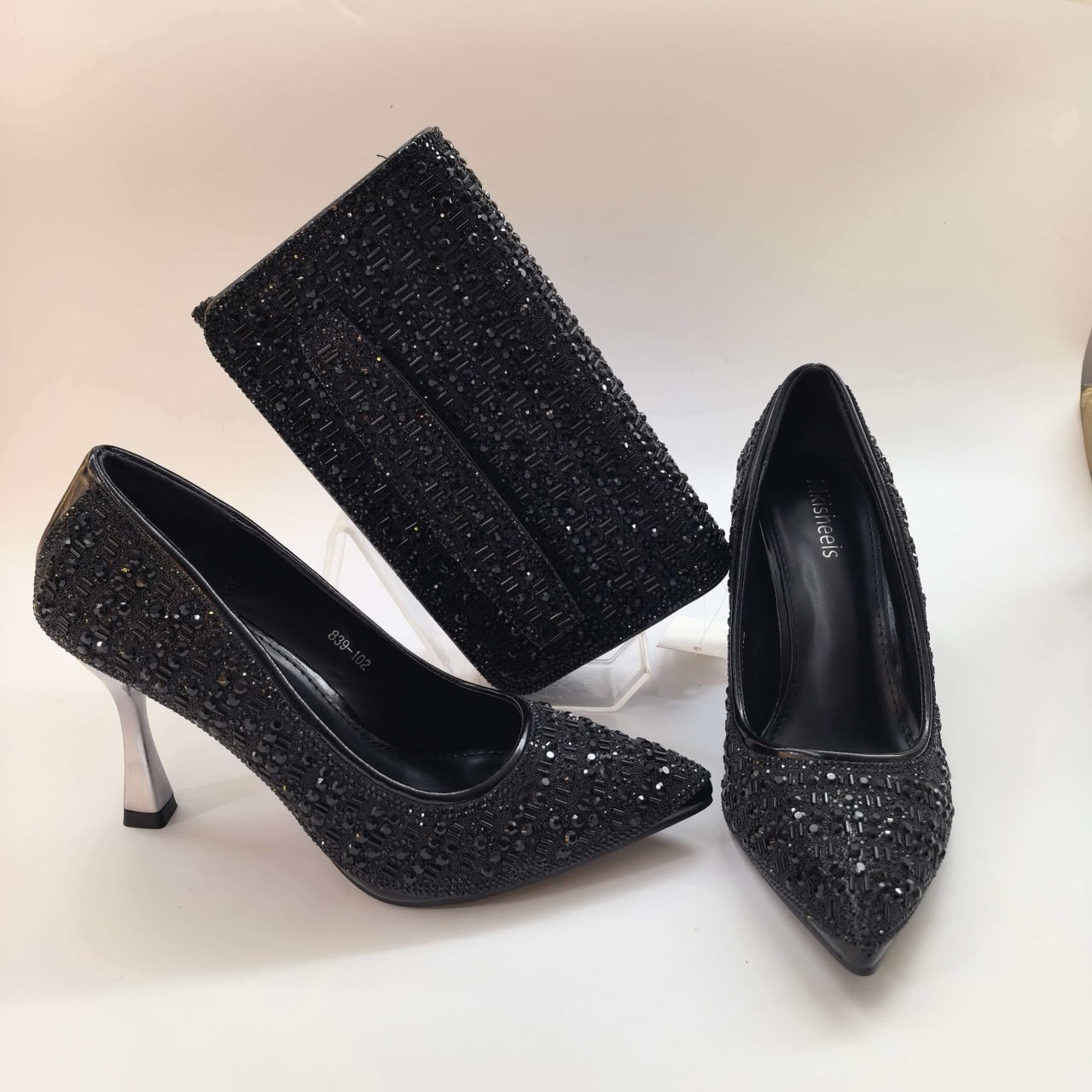 Black crystal stiletto heels with matching clutch