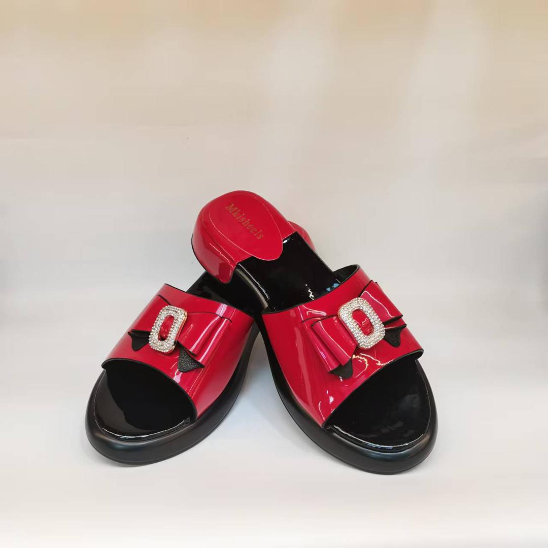 Red patent slides with crystal buckle